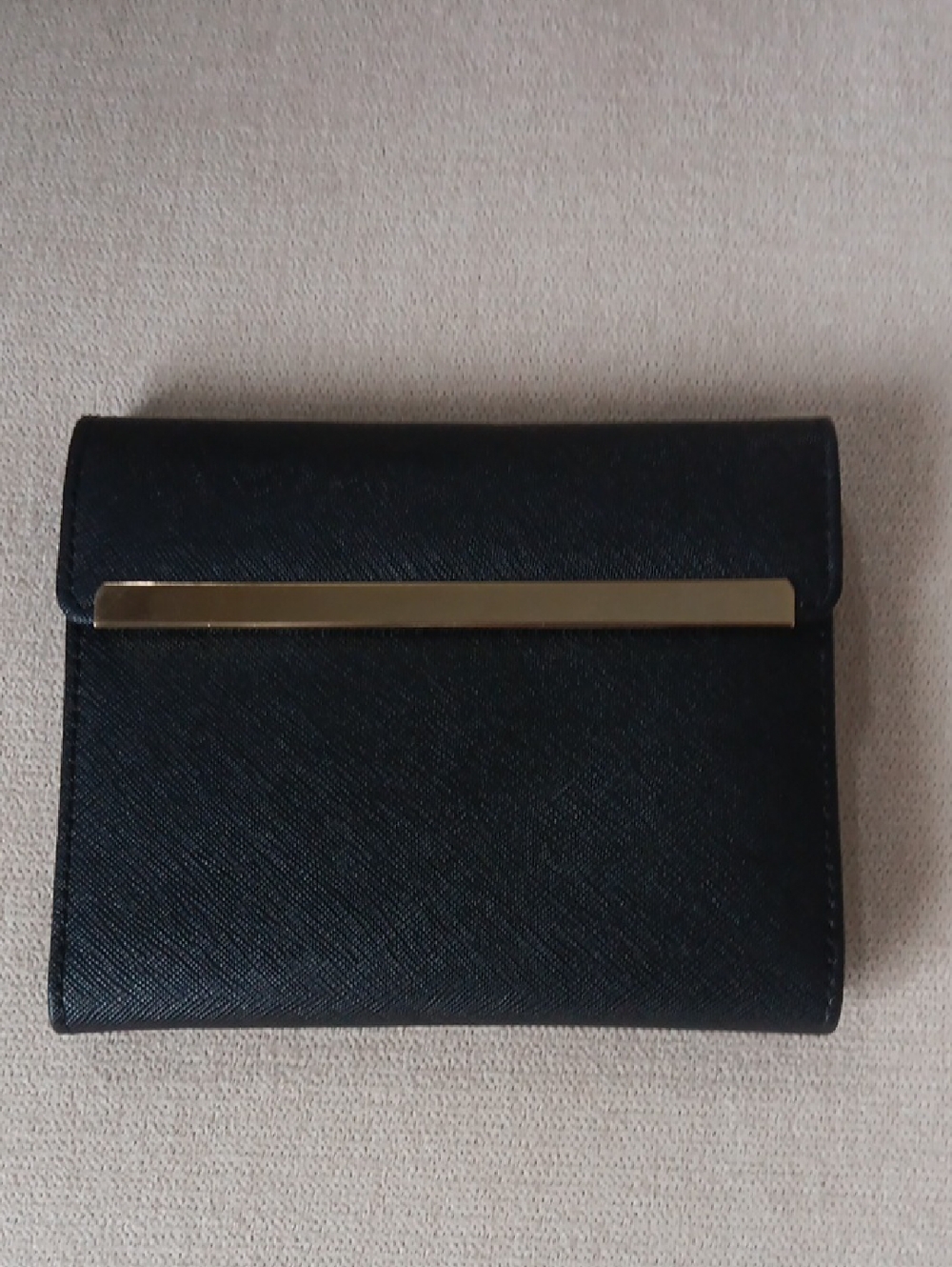 Danier Black Saffiano Leather Bifold Wallet with Gold Bar Accent